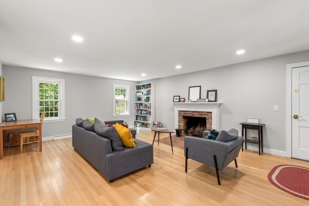 58 Old Coach Road Sudbury, MA 01776 - Photo 18 of 40 a living room with furniture and a fireplace