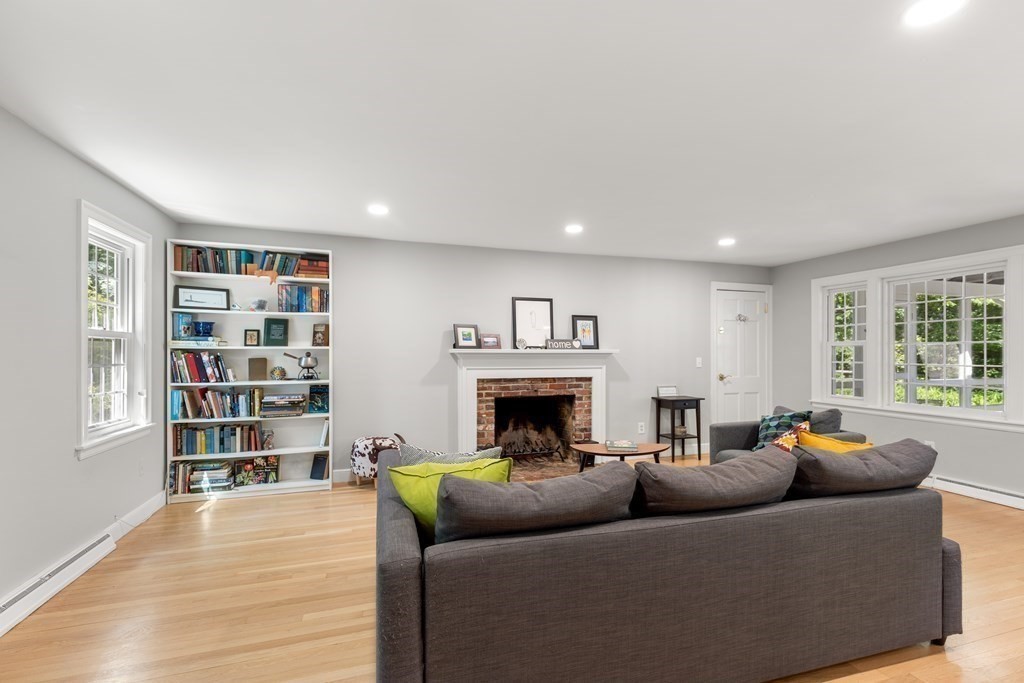 58 Old Coach Road Sudbury, MA 01776 - Photo 19 of 40 a living room with furniture and a fireplace