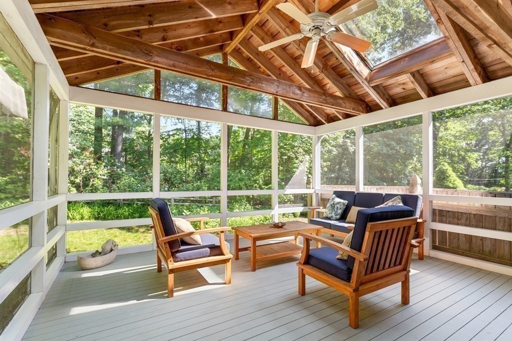 58 Old Coach Road Sudbury, MA 01776 - Photo 21 of 40 a roof deck with a table and chairs