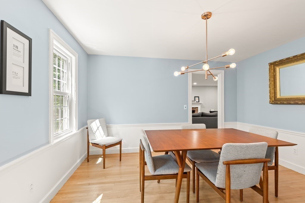 58 Old Coach Road Sudbury, MA 01776 - Photo 24 of 40 a view of a dining room with furniture and wooden floor