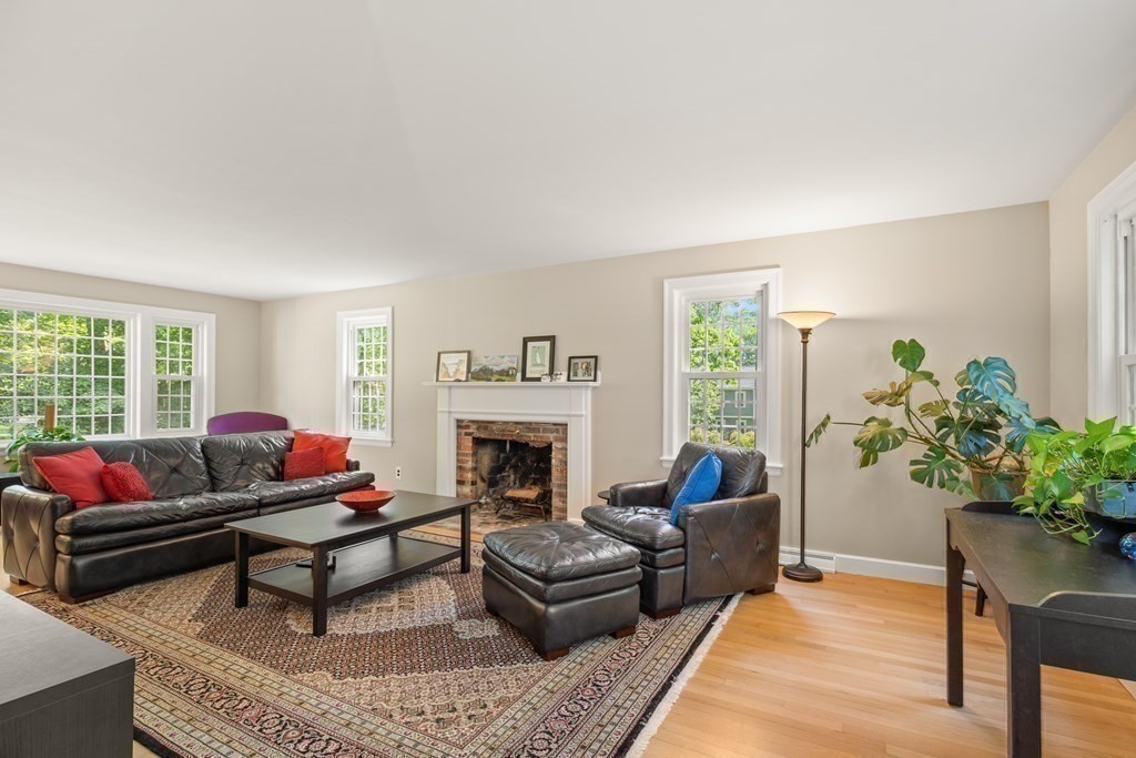 58 Old Coach Road Sudbury, MA 01776 - Photo 25 of 40 a living room with furniture and a fireplace