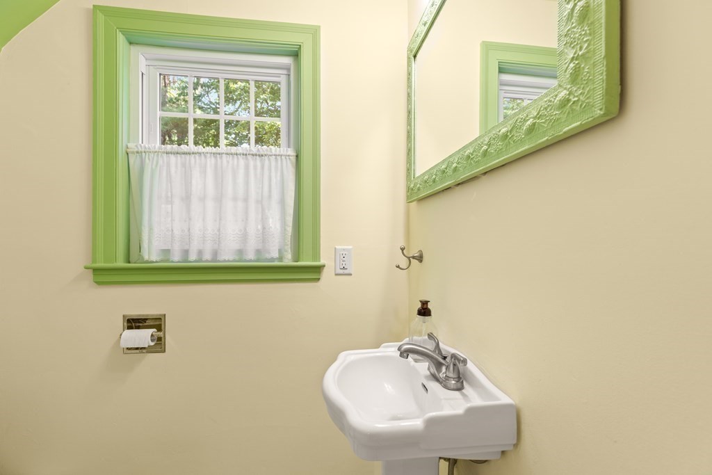 58 Old Coach Road Sudbury, MA 01776 - Photo 28 of 40 a bathroom with a sink and a mirror