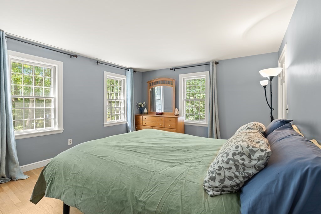 58 Old Coach Road Sudbury, MA 01776 - Photo 30 of 40 a bedroom with a large bed and a window