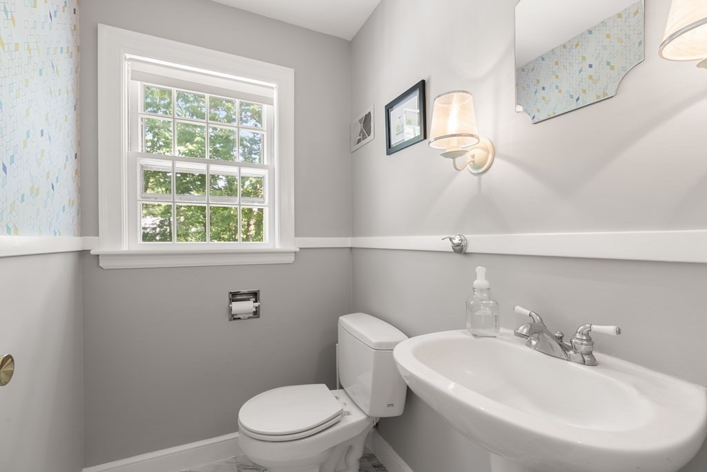 58 Old Coach Road Sudbury, MA 01776 - Photo 34 of 40 a bathroom with a toilet a sink and a window