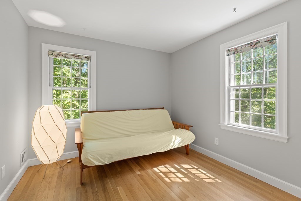 58 Old Coach Road Sudbury, MA 01776 - Photo 36 of 40 a bed sitting in a bedroom next to a window