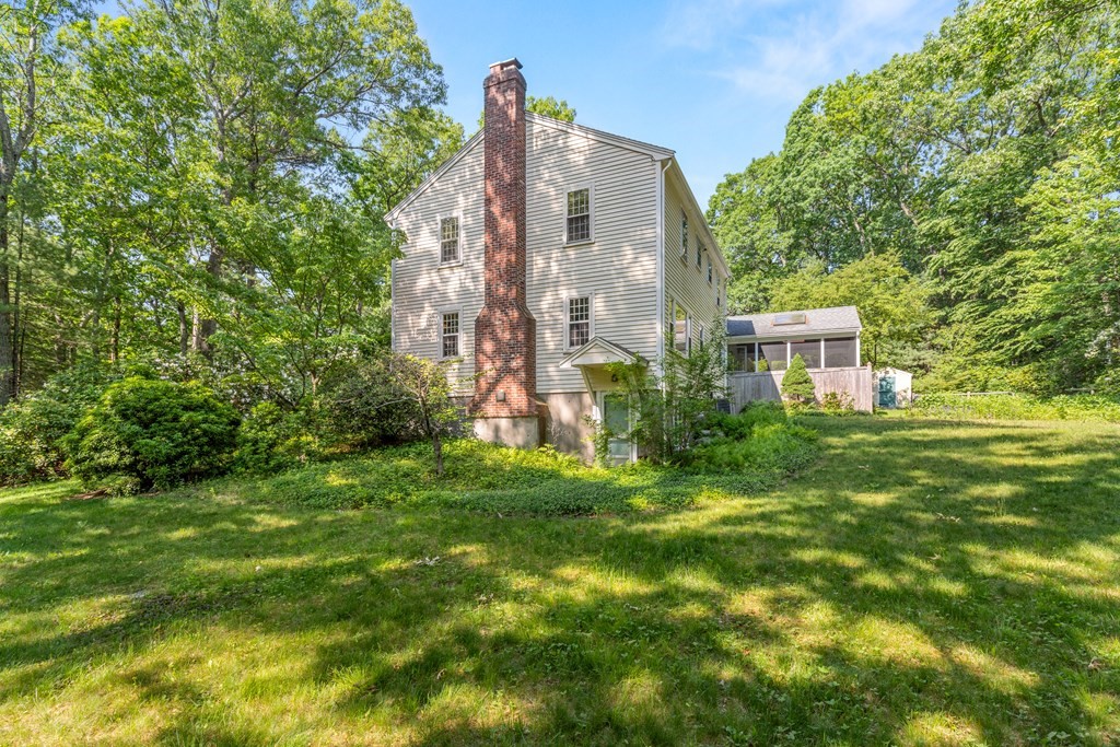 58 Old Coach Road Sudbury, MA 01776 - Photo 6 of 40 a view of a big yard in front of a house