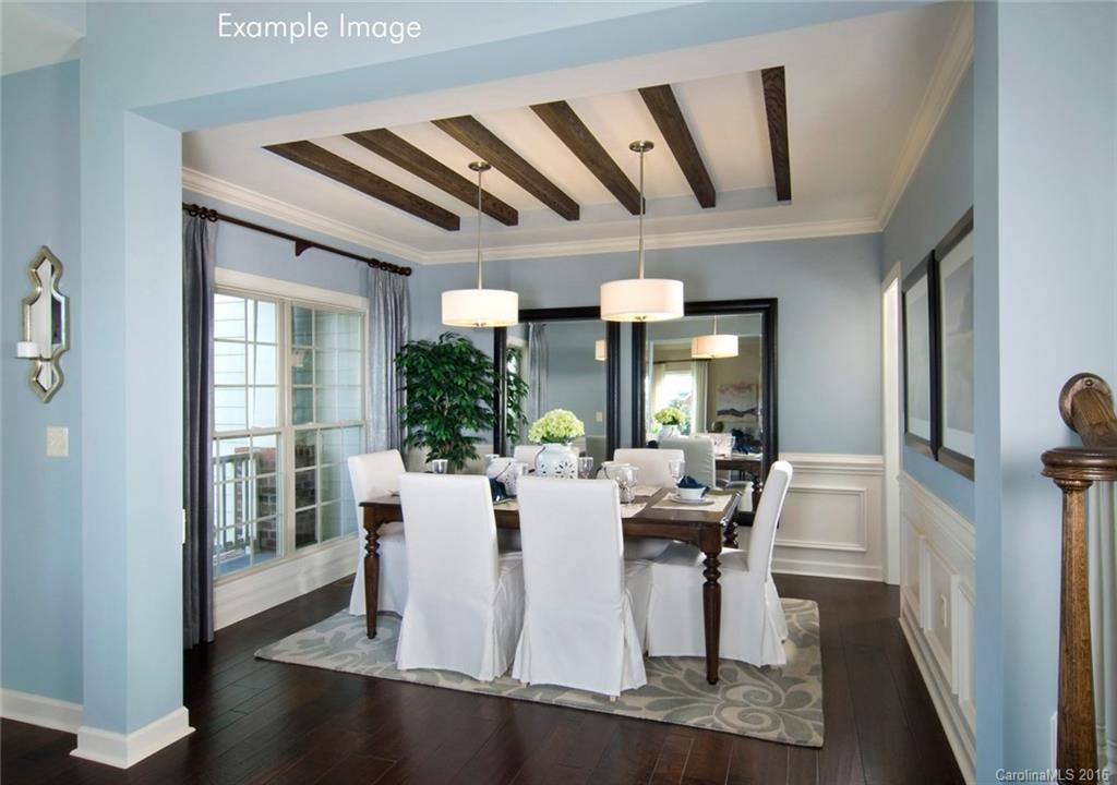 5271 Meadowcroft Way, Unit HAG0036 Fort Mill, SC 29708 - Photo 5 of 9 a view of a dining room with furniture window and wooden floor