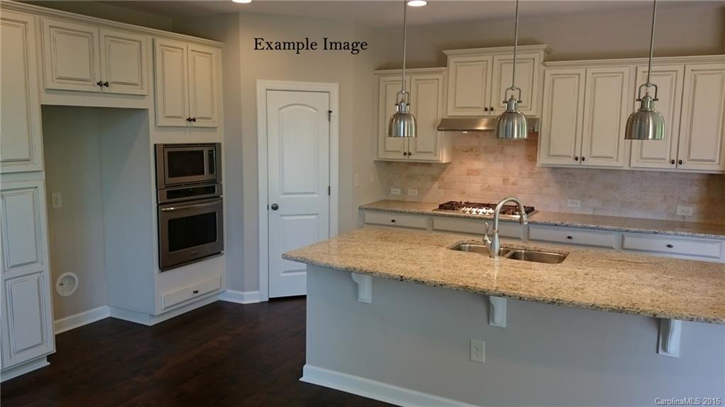 5271 Meadowcroft Way, Unit HAG0036 Fort Mill, SC 29708 - Photo 9 of 9 a kitchen with stainless steel appliances granite countertop a sink a stove and a refrigerator