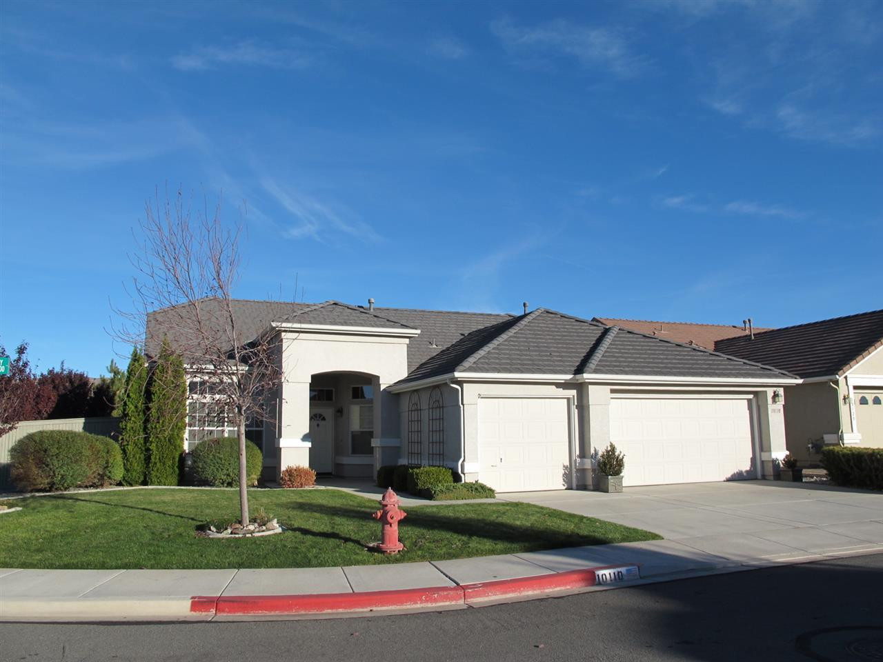 10110 Lucente Way Reno, NV 89521 - Photo 1 of 1 a front view of a house with a yard