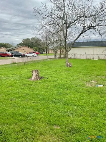 a view of a house with a big yard
