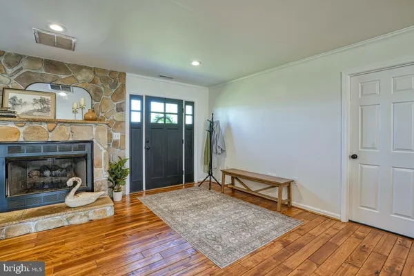a kitchen with stainless steel appliances kitchen island granite countertop a sink and cabinets