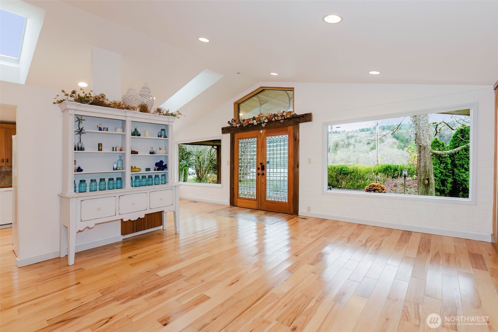 12241 Olalla Valley Road Southeast Olalla, WA 98359 - Photo 12 of 39 a view of livingroom with furniture window and wooden floor