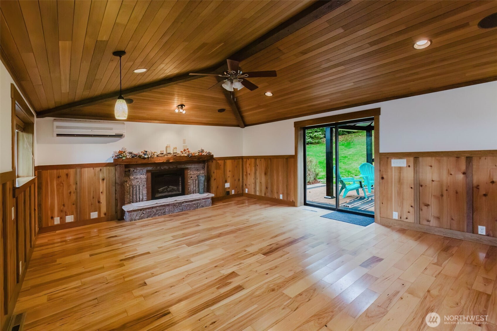 12241 Olalla Valley Road Southeast Olalla, WA 98359 - Photo 15 of 39 a view of a room with wooden floor a ceiling fan and window