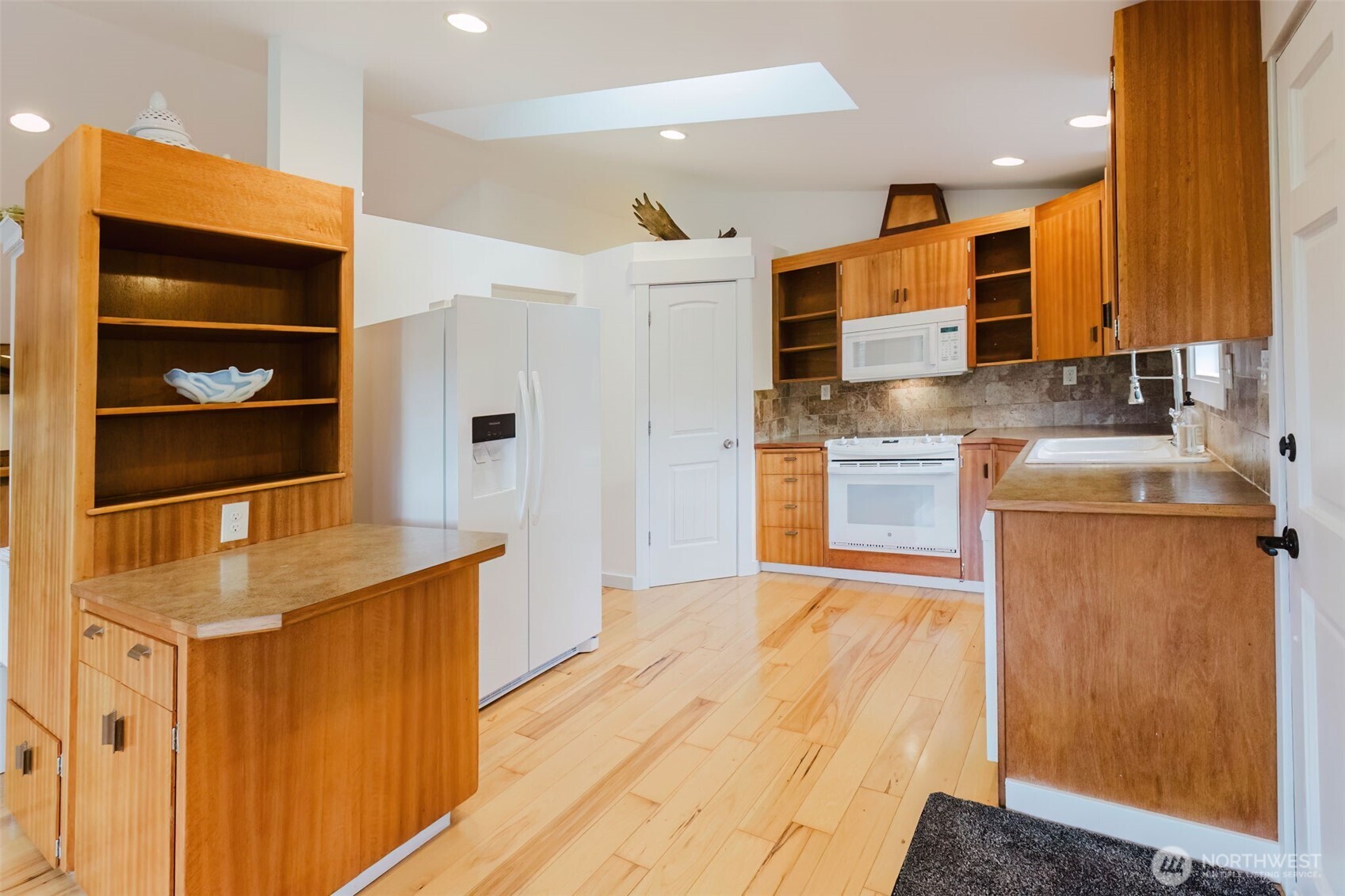 12241 Olalla Valley Road Southeast Olalla, WA 98359 - Photo 18 of 39 a kitchen with stainless steel appliances granite countertop a sink and wooden cabinets