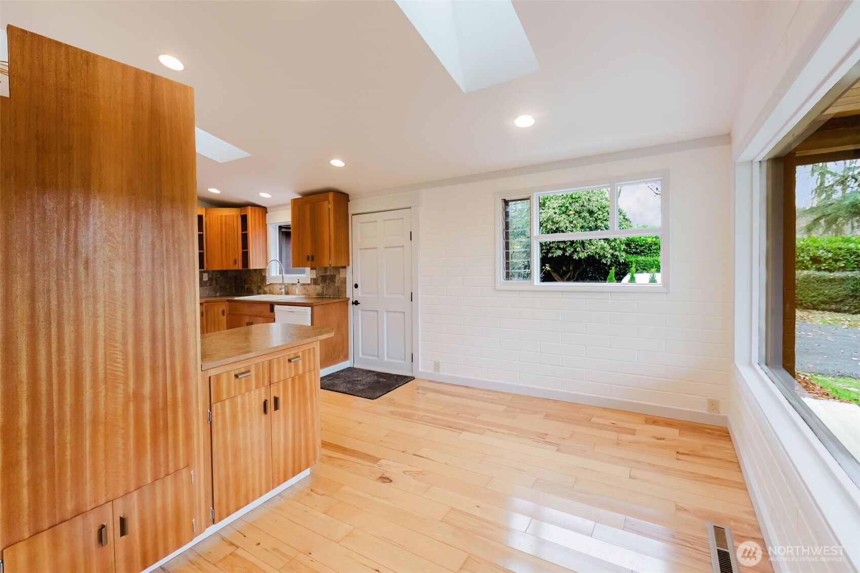 12241 Olalla Valley Road Southeast Olalla, WA 98359 - Photo 20 of 39 a kitchen with stainless steel appliances kitchen island granite countertop a refrigerator and a sink