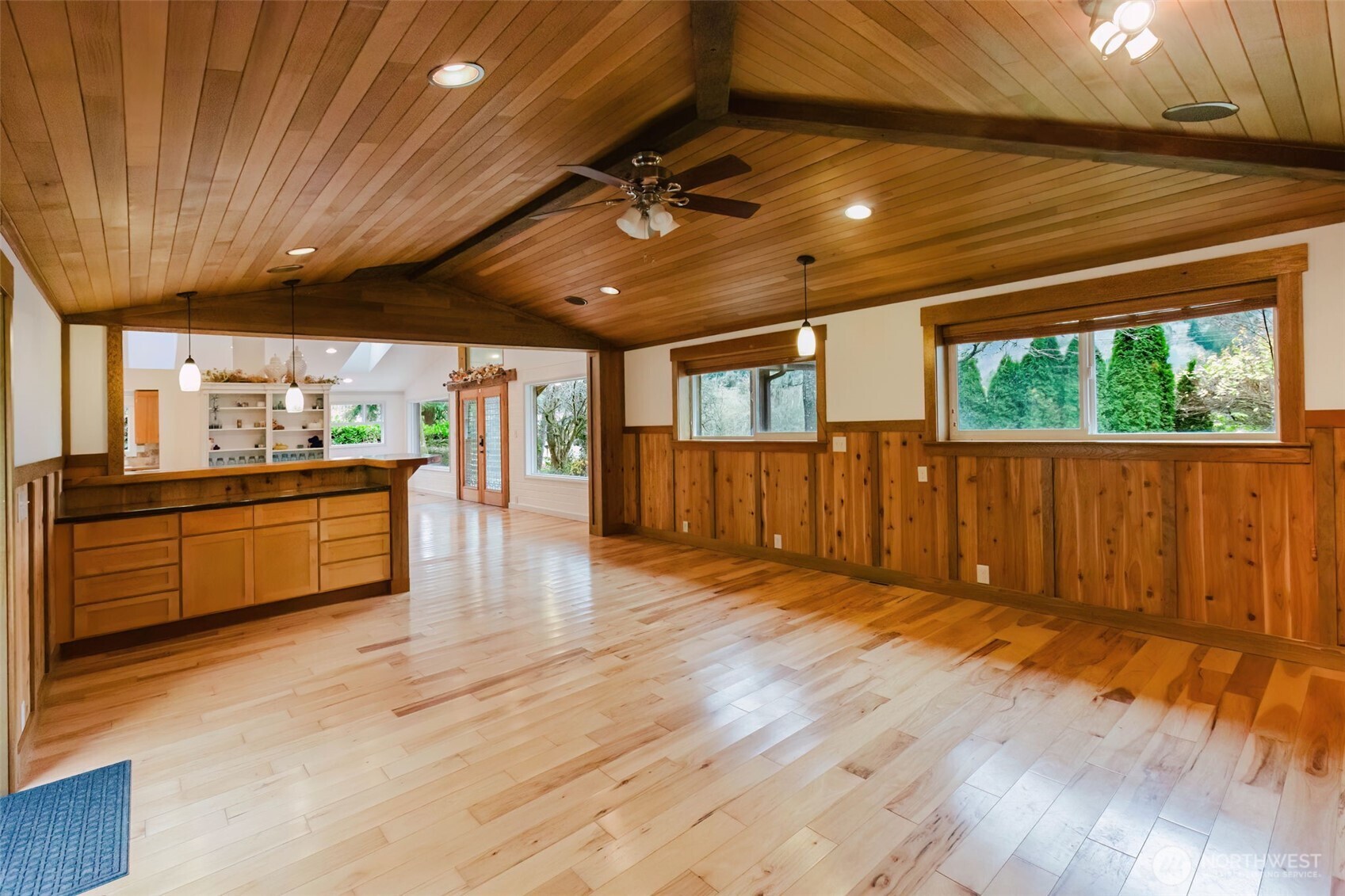 12241 Olalla Valley Road Southeast Olalla, WA 98359 - Photo 8 of 39 a kitchen with stainless steel appliances wooden floors stove sink and cabinets