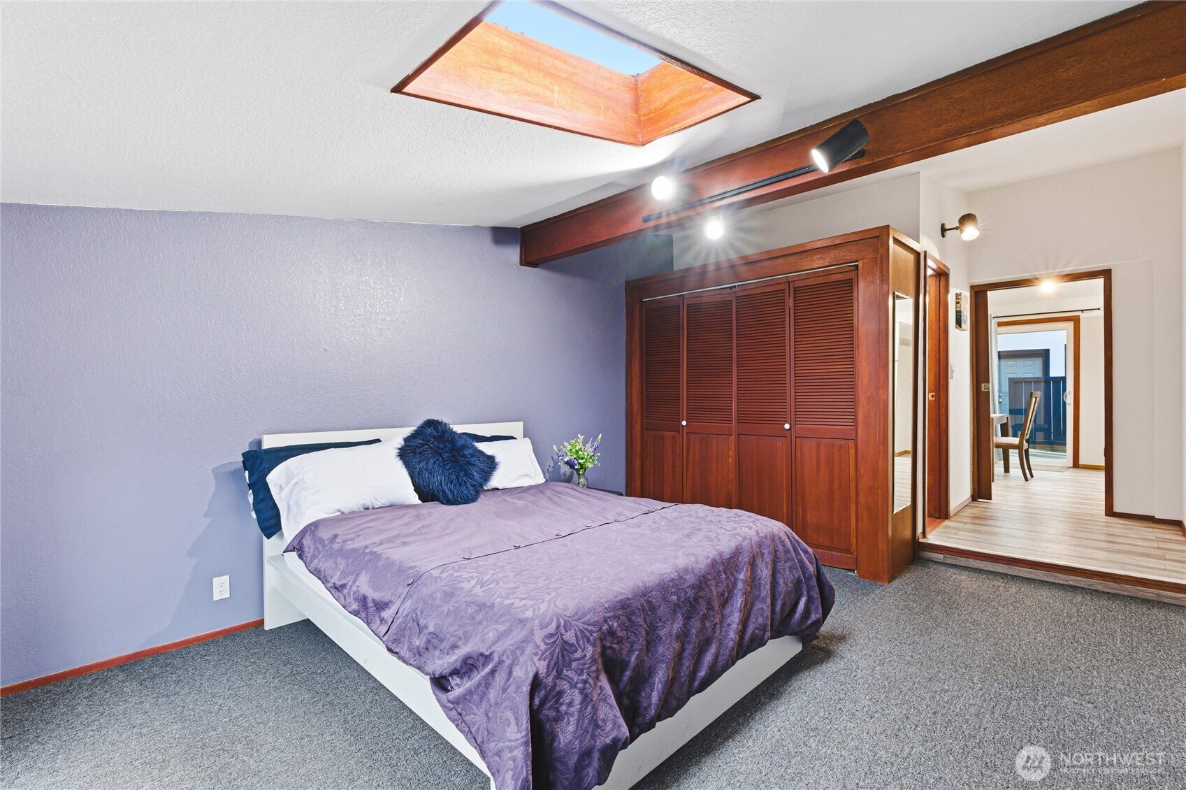 11090 25th Avenue Southwest Seattle, WA 98146 - Photo 16 of 38 a bedroom with a large bed and a closet