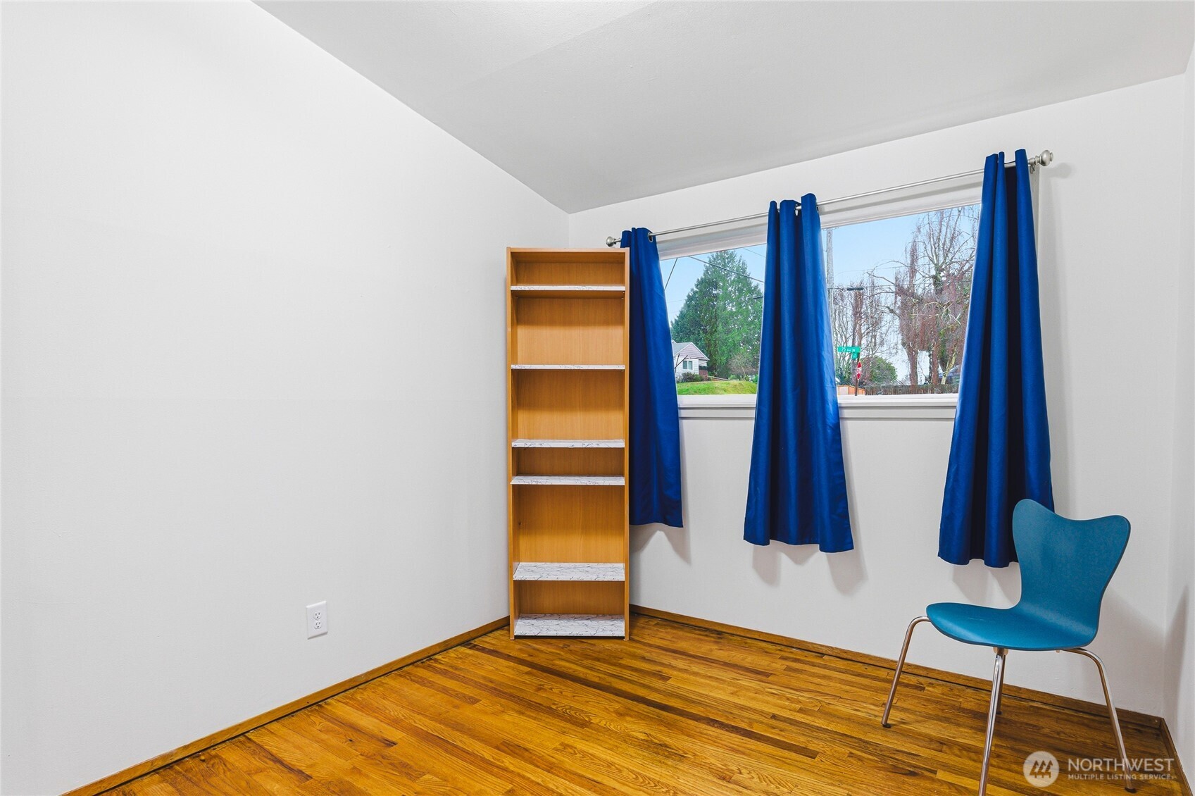 11090 25th Avenue Southwest Seattle, WA 98146 - Photo 20 of 38 a view of room with balcony and wooden floor