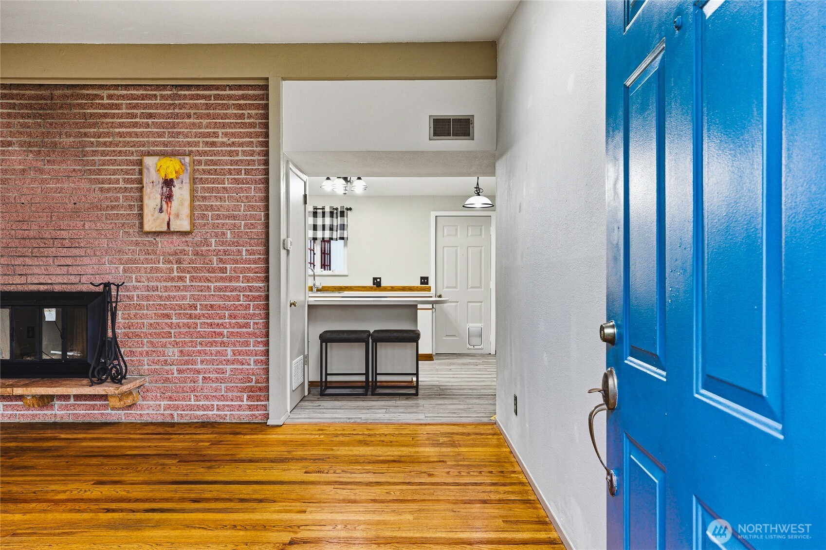 11090 25th Avenue Southwest Seattle, WA 98146 - Photo 3 of 38 a view of a kitchen from the hallway