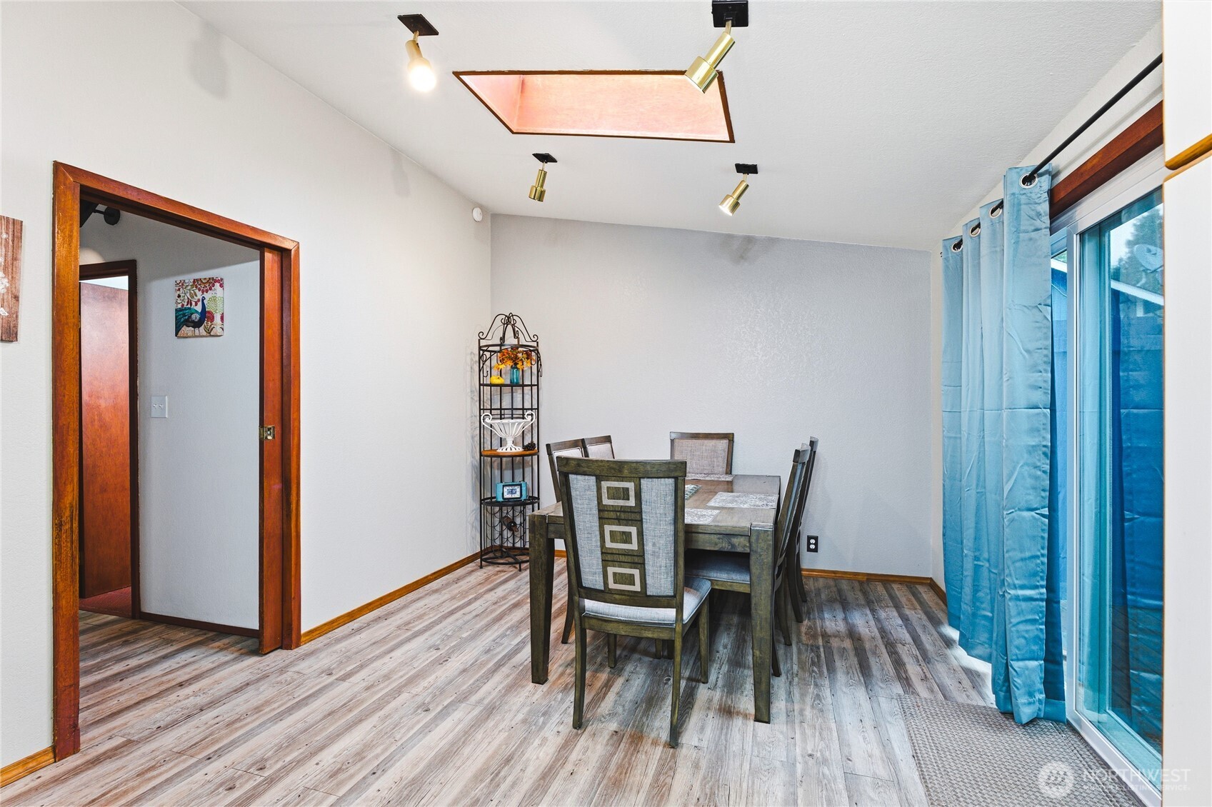 11090 25th Avenue Southwest Seattle, WA 98146 - Photo 10 of 38 a view of a dining room with furniture and wooden floor