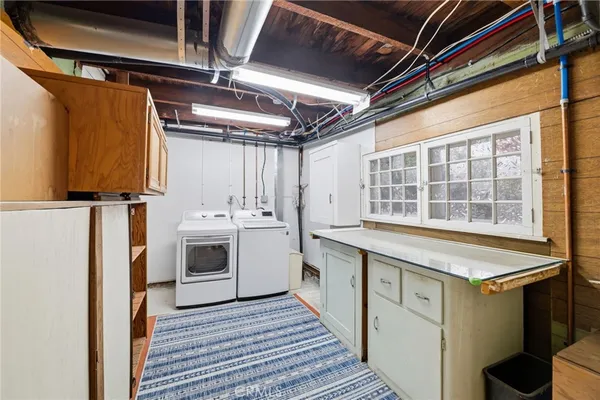 an empty room with closet and windows