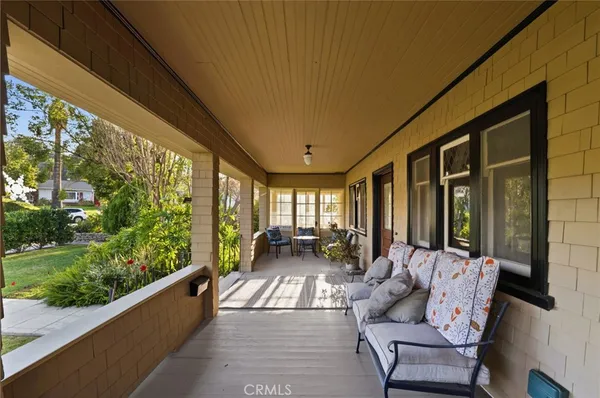 a wooden bench sitting in backyard of a house