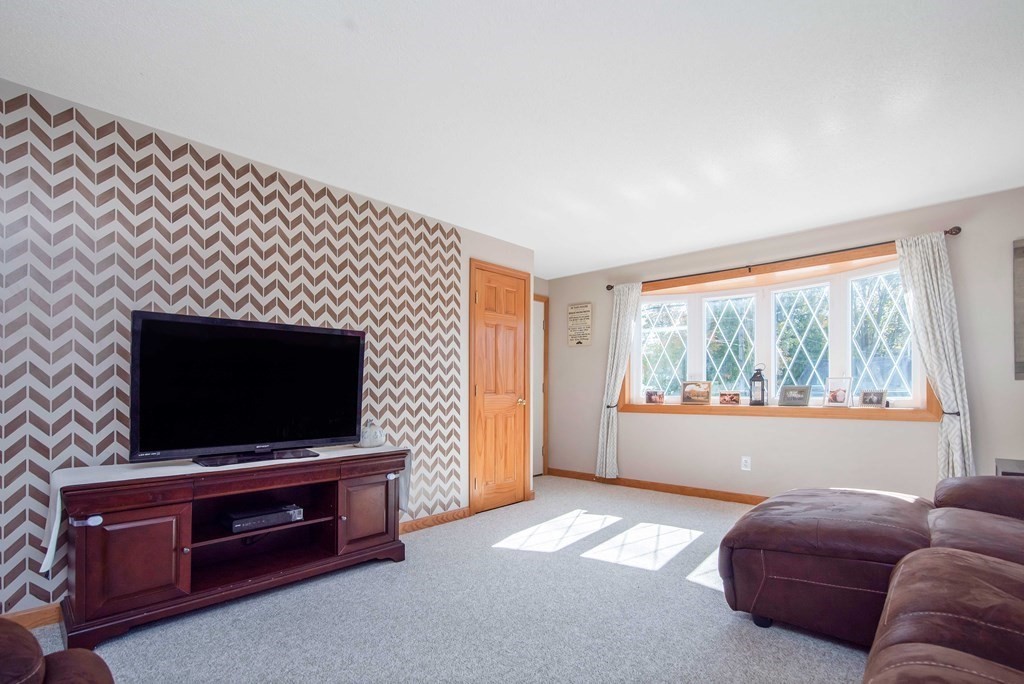 975 Allen Street Springfield, MA 01118 - Photo 3 of 30 a living room with furniture and a flat screen tv