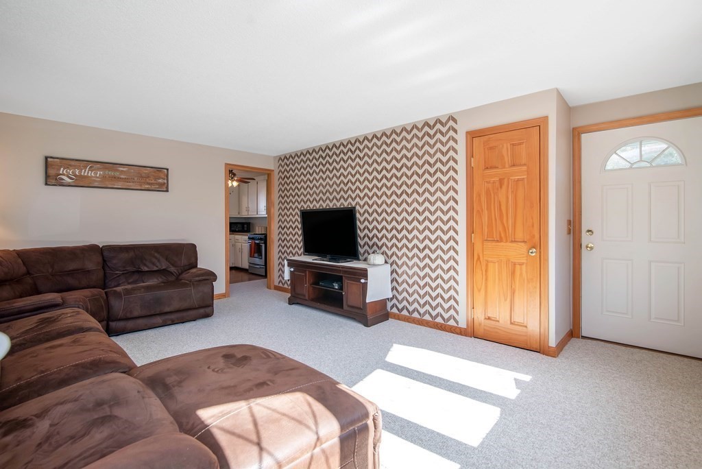 975 Allen Street Springfield, MA 01118 - Photo 5 of 30 a living room with furniture and a flat screen tv