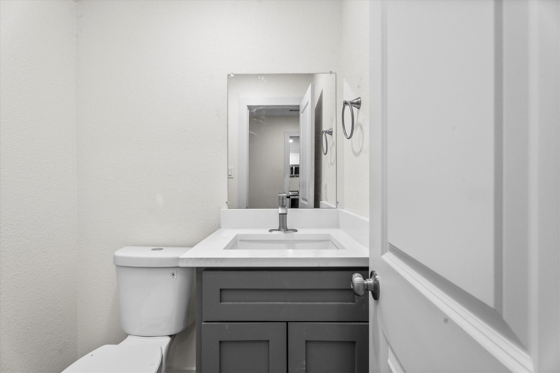 6162 Beldart Street Houston, TX 77033 - Photo 16 of 36 a bathroom with a sink and a mirror