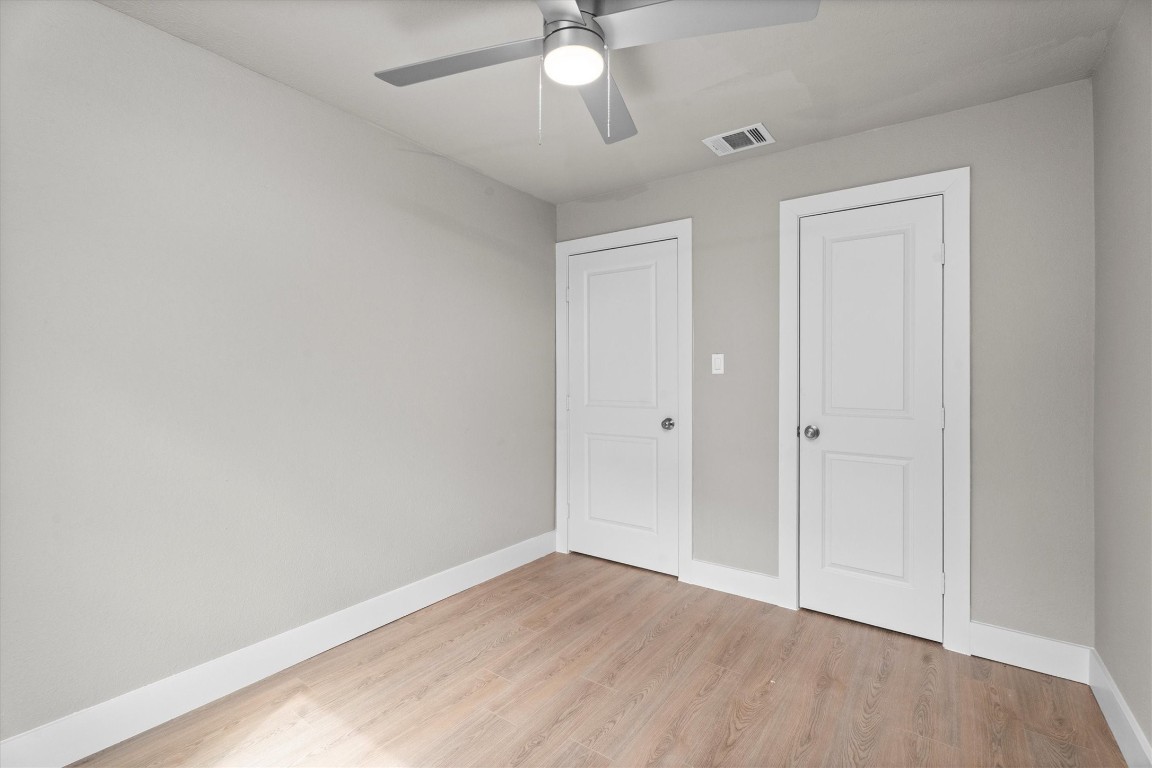 6162 Beldart Street Houston, TX 77033 - Photo 19 of 36 wooden floor in an empty room