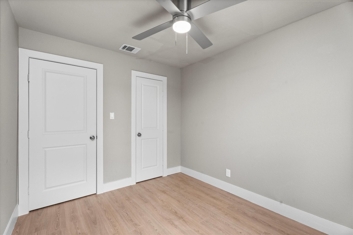 6162 Beldart Street Houston, TX 77033 - Photo 20 of 36 wooden floor in an empty room