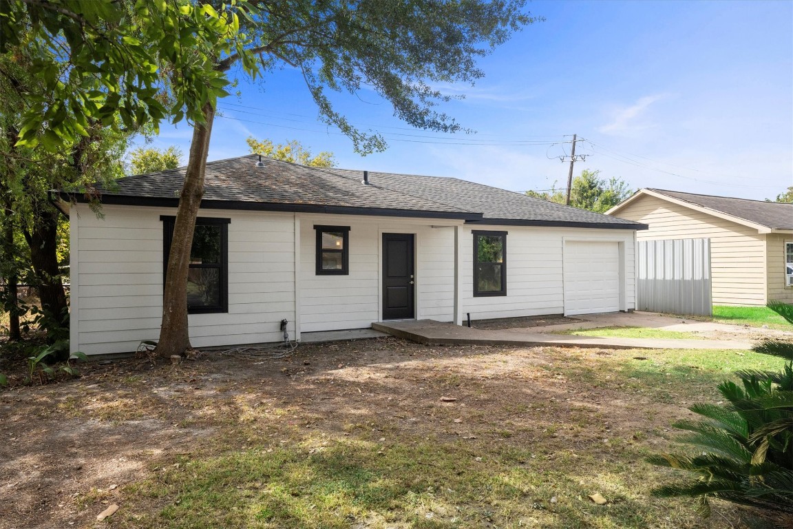 6162 Beldart Street Houston, TX 77033 - Photo 2 of 36 a view of a house with a yard