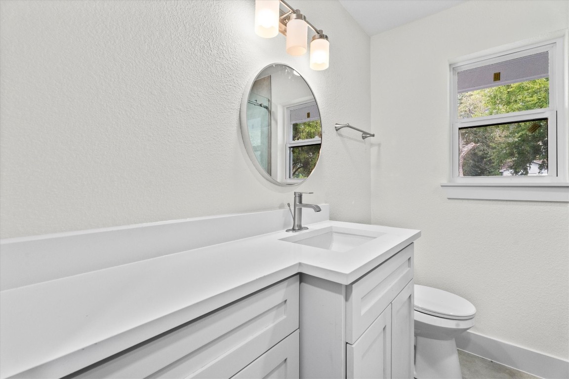 6162 Beldart Street Houston, TX 77033 - Photo 22 of 36 a bathroom with a sink and a mirror