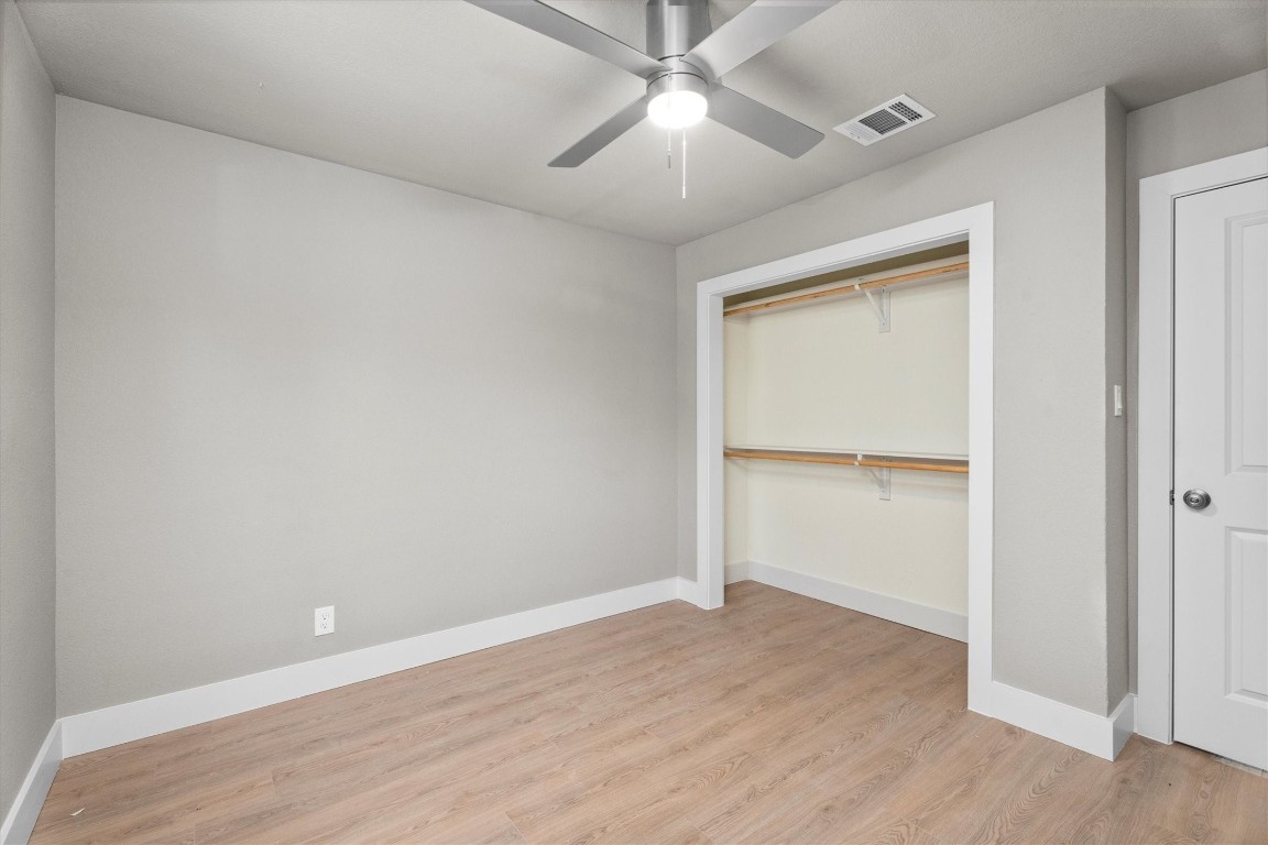 6162 Beldart Street Houston, TX 77033 - Photo 24 of 36 a view of an empty room with wooden floor