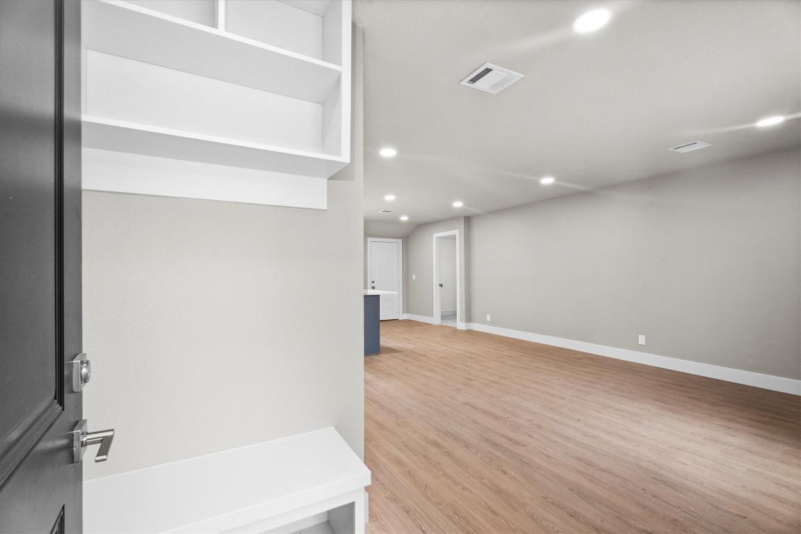 6162 Beldart Street Houston, TX 77033 - Photo 4 of 36 a view of an empty room with wooden floor