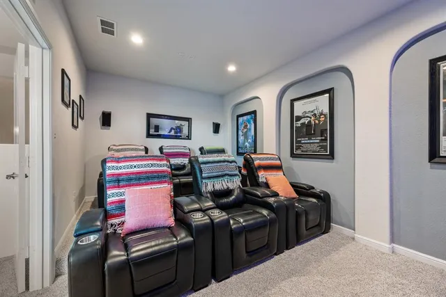 a spacious bathroom with a tub sink shower and mirror