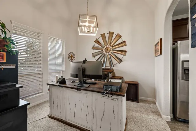 a view of a porch with furniture and a fireplace