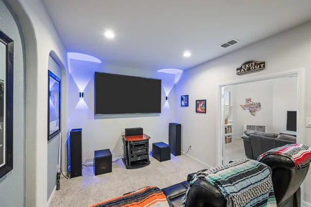 a bathroom with a sink toilet and mirror
