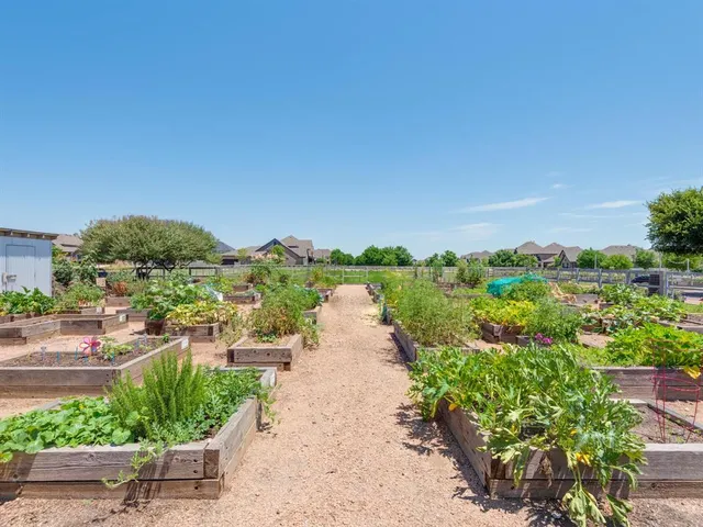 an aerial view of a house with outdoor seating