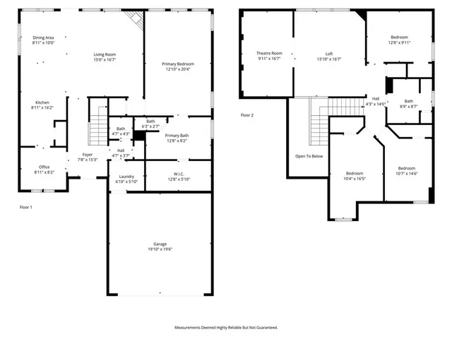 an aerial view of a house with a yard and lake view