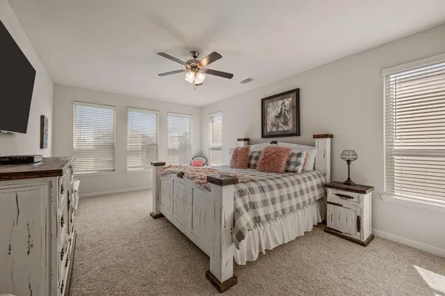a kitchen with kitchen island granite countertop a stove and a sink