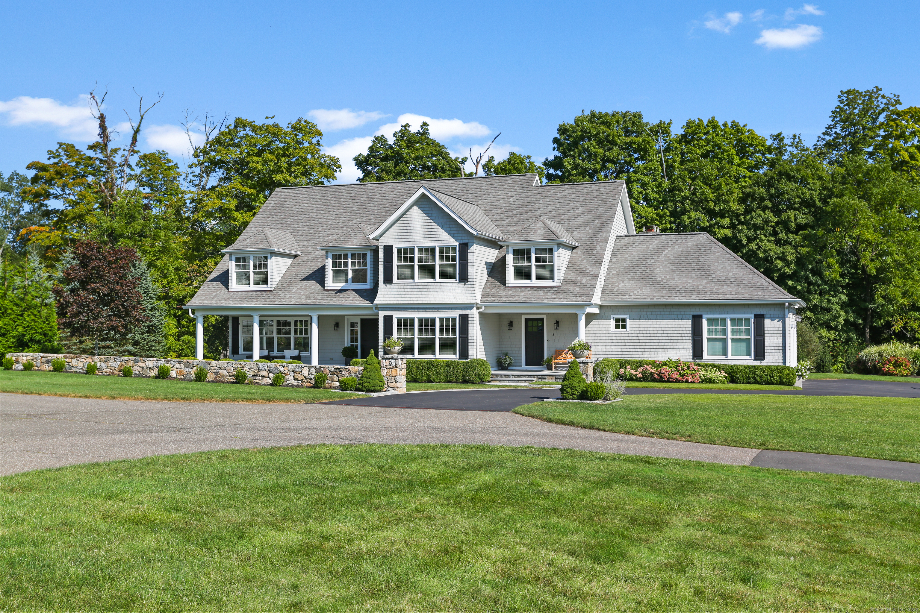 3 Calder Bridge Drive, Unit 2 Stamford, CT 06903 - Photo 1 of 1 a front view of a house with a garden