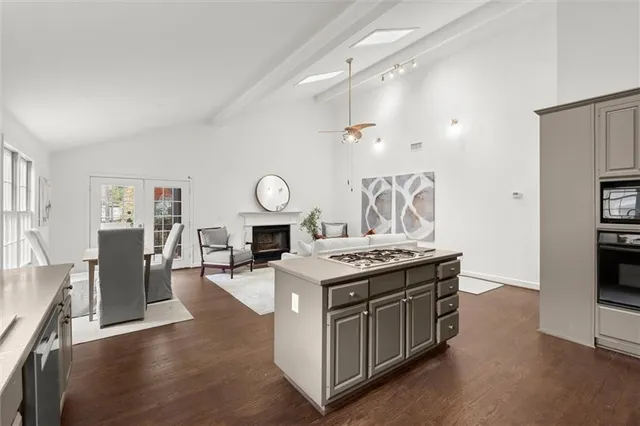 a kitchen with a stove and a refrigerator