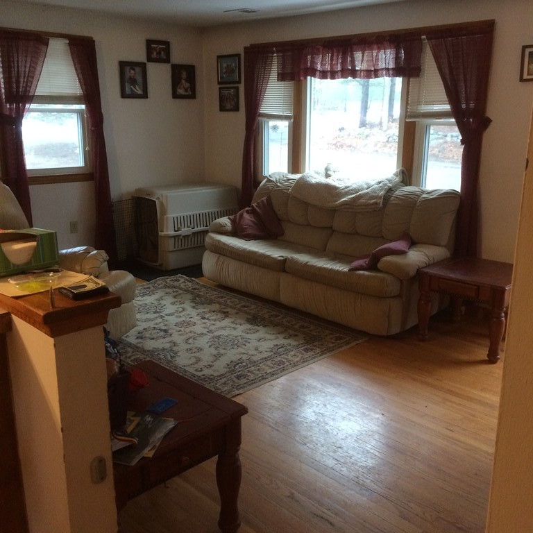 12 Kingsbury Road Webster, MA 01570 - Photo 3 of 18 a living room with furniture and a large window