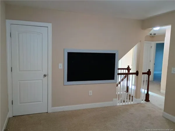 a view of a livingroom with a flat screen tv