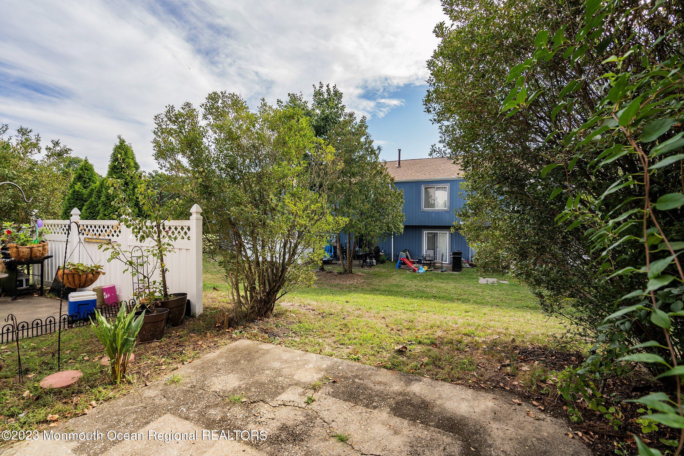 69 Creek Road, Unit 437 Brick, NJ 08724 - Photo 20 of 23 20-Backyard