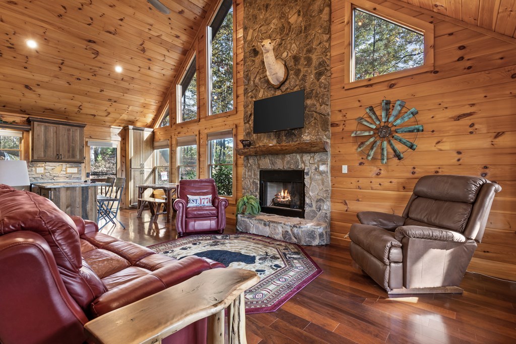 653 The Woods Road Mineral Bluff, GA 30559 - Photo 18 of 56 a living room with furniture and a fireplace