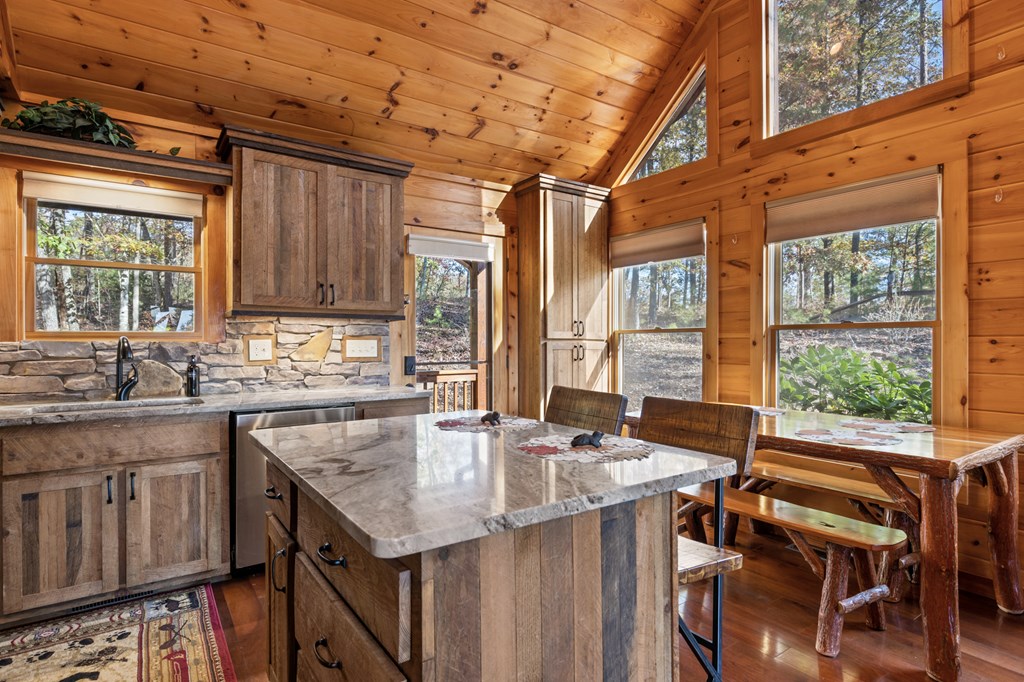 653 The Woods Road Mineral Bluff, GA 30559 - Photo 20 of 56 a kitchen with a stove a sink and a refrigerator