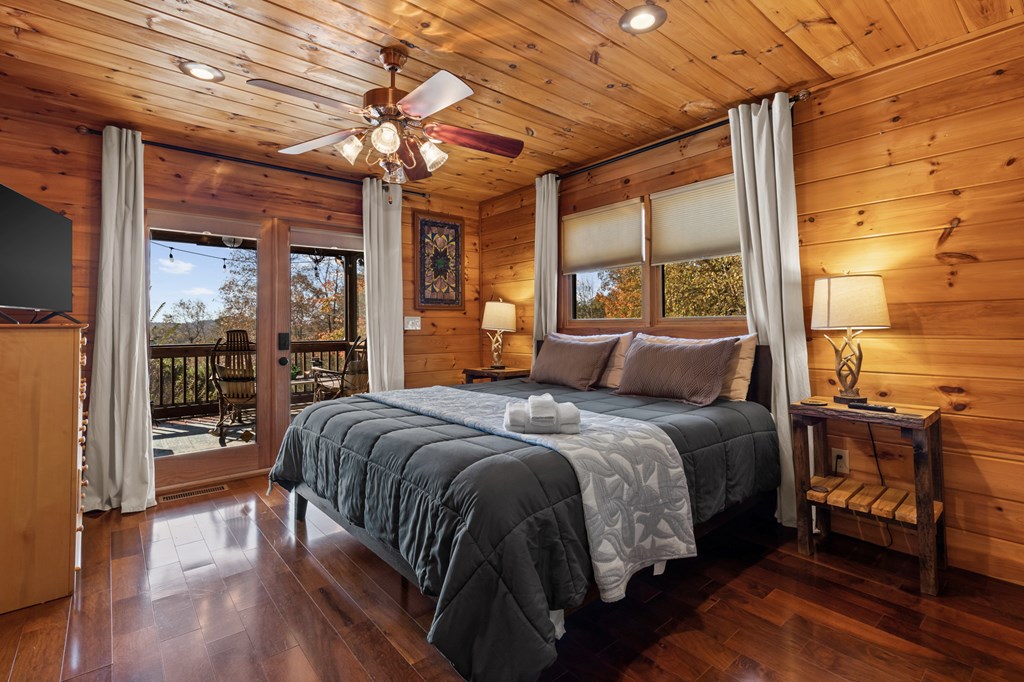 653 The Woods Road Mineral Bluff, GA 30559 - Photo 22 of 56 a bed sitting in a bedroom next to a window