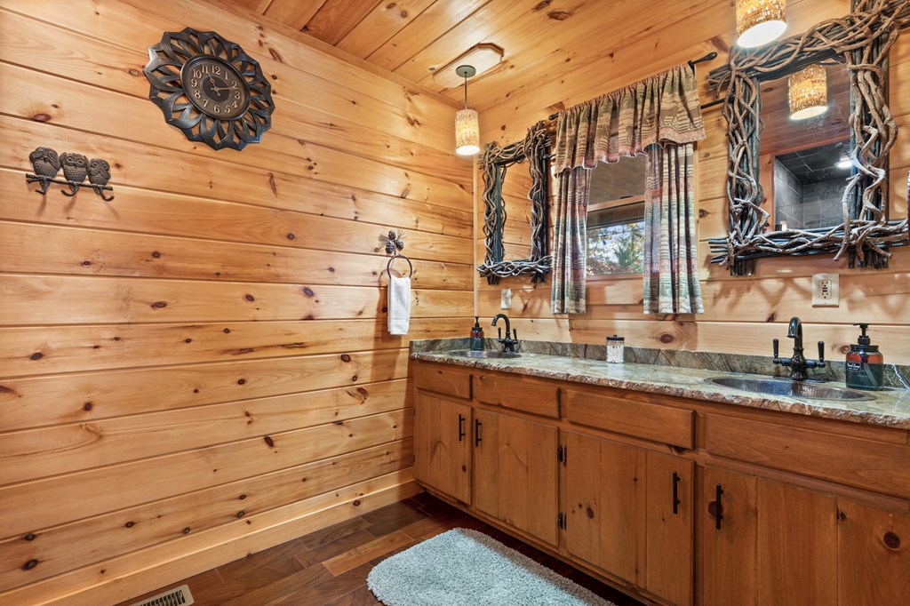 653 The Woods Road Mineral Bluff, GA 30559 - Photo 24 of 56 a bathroom with a sink and a mirror